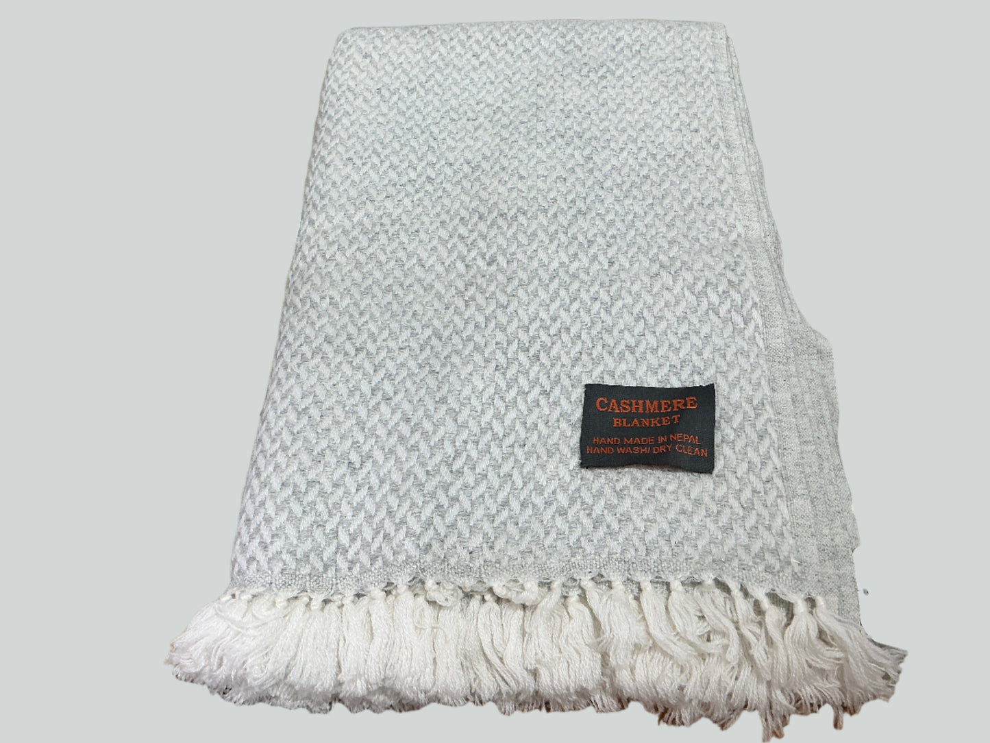 Dove grey cashmere fringe blanket