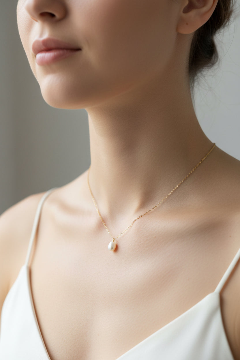 Gold Necklace with Gem Pendant $50
